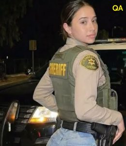 HT4. THIS YOUNG POLICE OFFICER will record her after her service…