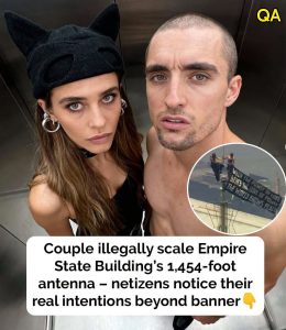 HT16. Couple scales Empire State Building – people question true intentions