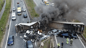 HT5. Overturned Hazardous Materials Lorry Triggers Massive Fire and Road Blockade